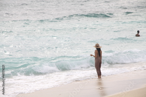 person walking on the beach