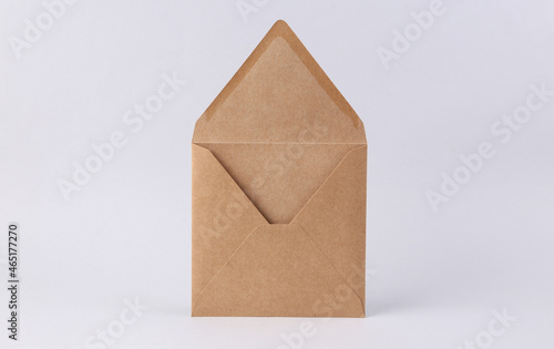 Open blank craft envelope on white background