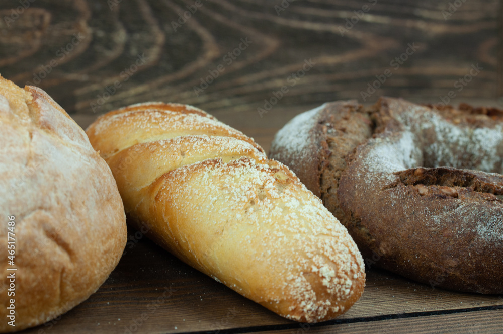 fresh country bread on a wooden background