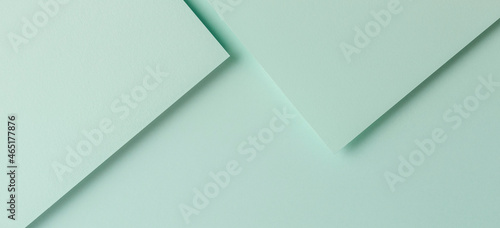 Minimal geometric shapes and lines in light green color. Abstract monochrome creative paper texture banner background