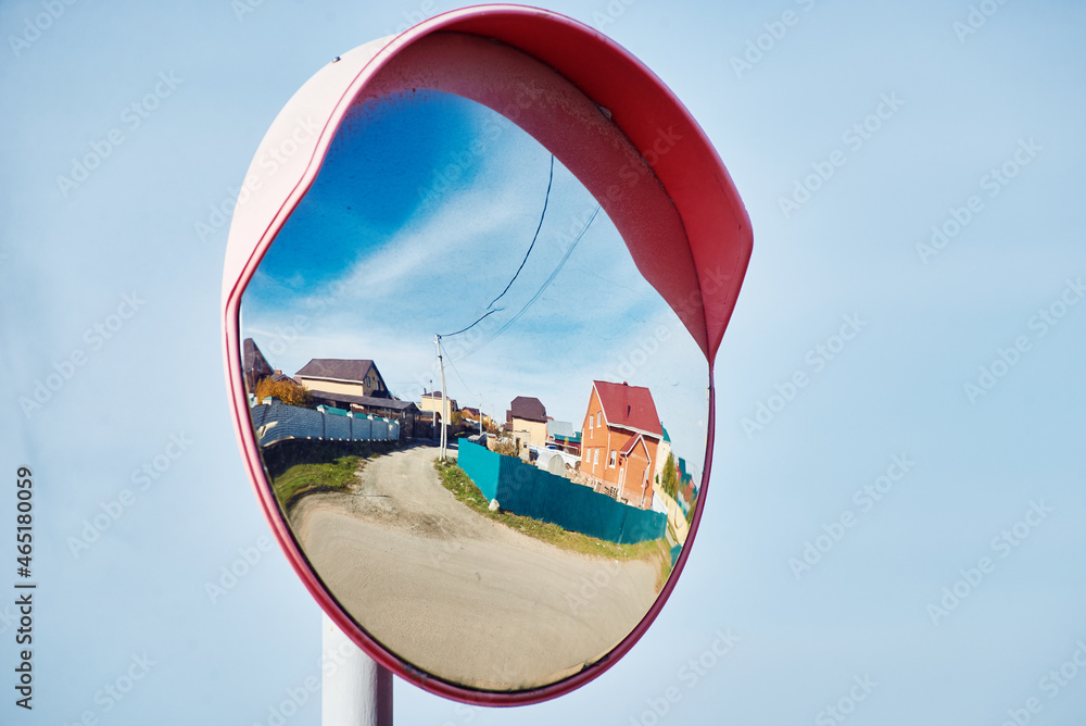 A special mirror for viewing the road. Emergency device on the background of the sky.