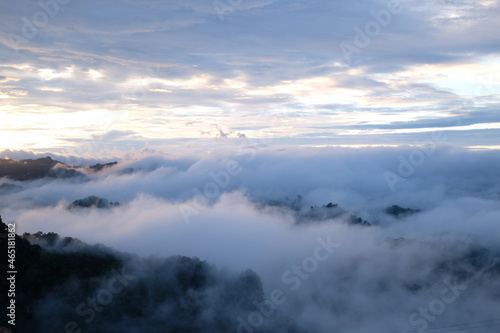 Beautiful mountain sunrise with sunlight and fog over northern Thailand's mountains