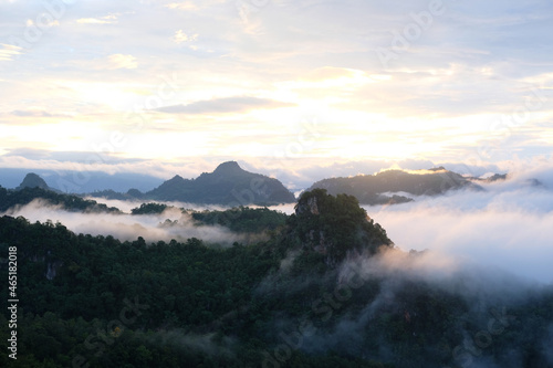 Beautiful mountain sunrise with sunlight and fog over northern Thailand s mountains
