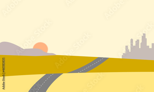 Landscape with road leading to a distant city at sunset