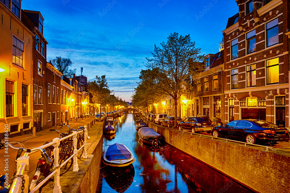 Channels in The City of Amsterdam in The Netherlands at Twlight with Boats