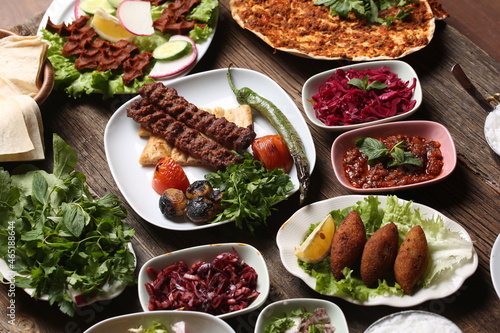 Fototapeta Naklejka Na Ścianę i Meble -  adana kebab and salad varieties