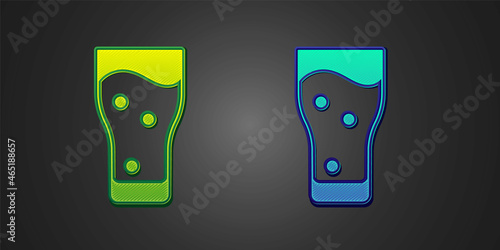 Green and blue Glass of beer icon isolated on black background. Vector