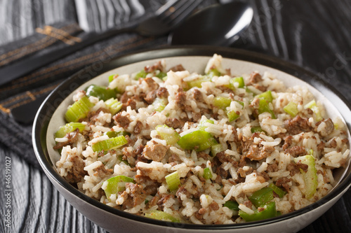 Cajun dirty rice with chicken liver, minced meat, celery and pepper and close-up in a bowl on the table. horizontal
