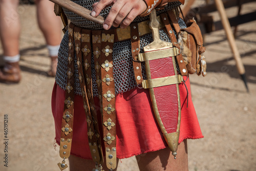Centurion girding a pugio, a dagger used by roman soldiers as a sidearm Fototapet