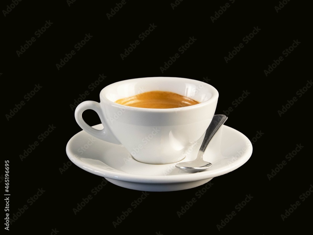 A cup of coffee with black background. A cup of coffee with black background.