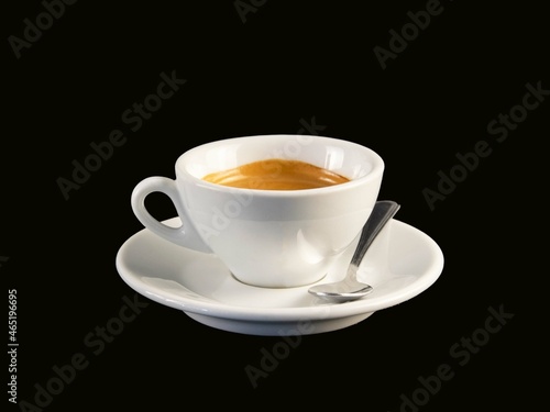 A cup of coffee with black background.