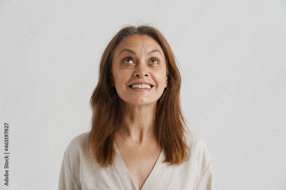 European ginger woman smiling and looking upward European ginger woman smiling and looking upward
