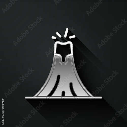 Silver Volcano eruption with lava icon isolated on black background. Long shadow style. Vector