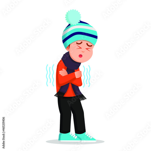 A boy in winter clothes feels cold