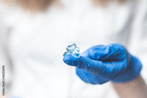 medical gel on doctor's glove, preparation for rectal examination.