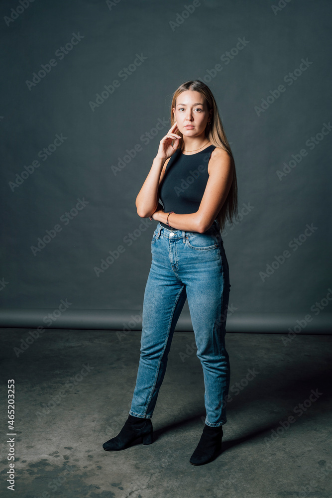Confident woman standing in studio Confident woman standing in studio