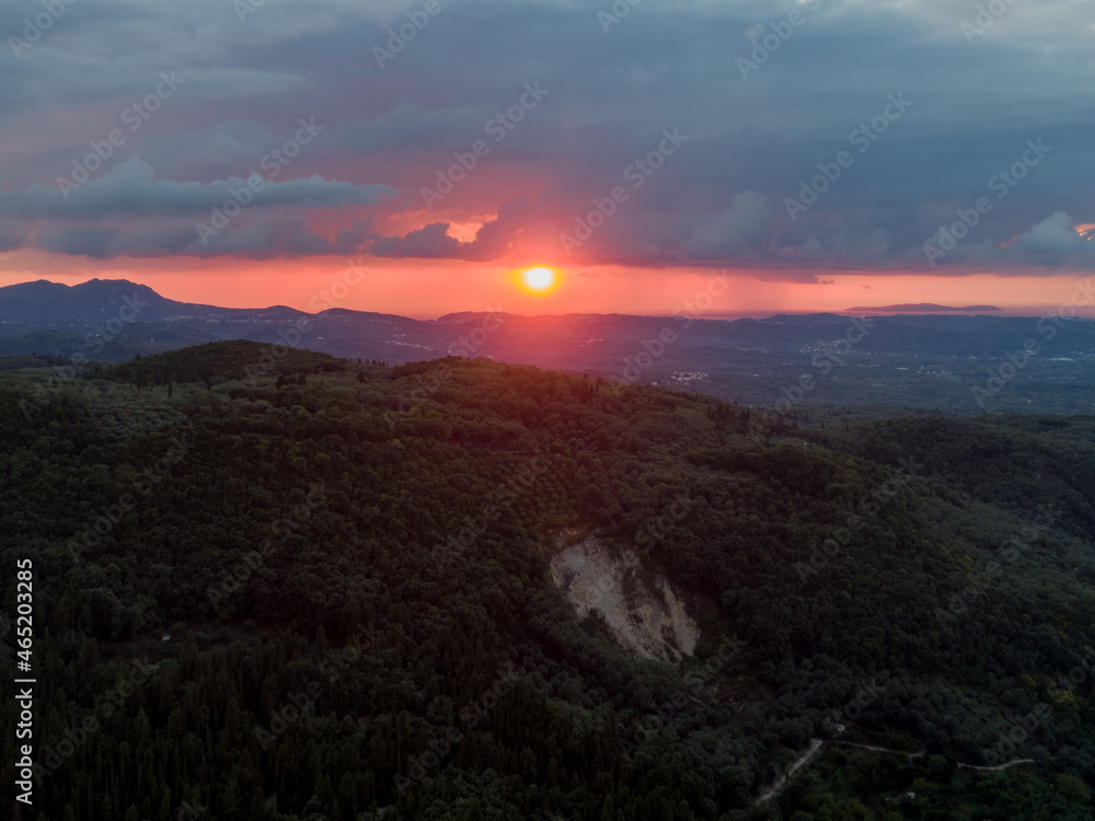 Aerial drone shot of sunset over mountains

