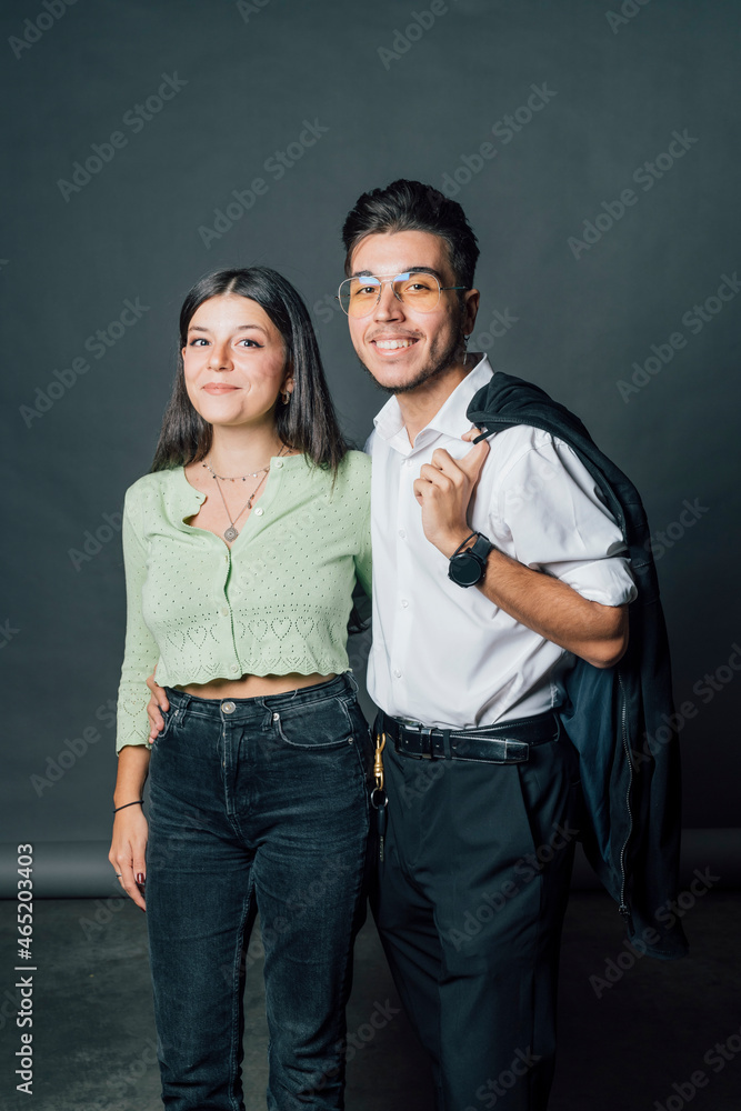Smiling couple standing together in studio Smiling couple standing together in studio