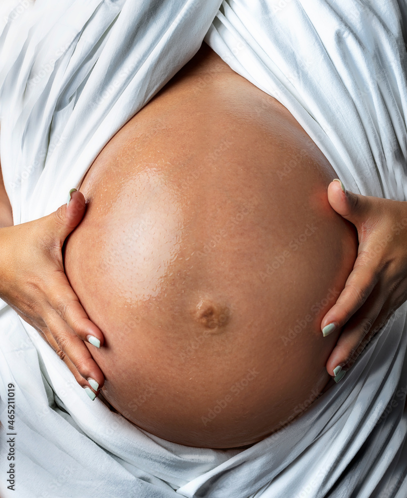 pregnant belly Poster Pregnant belly oiled with white sheet. – Wall Art | UkPosters