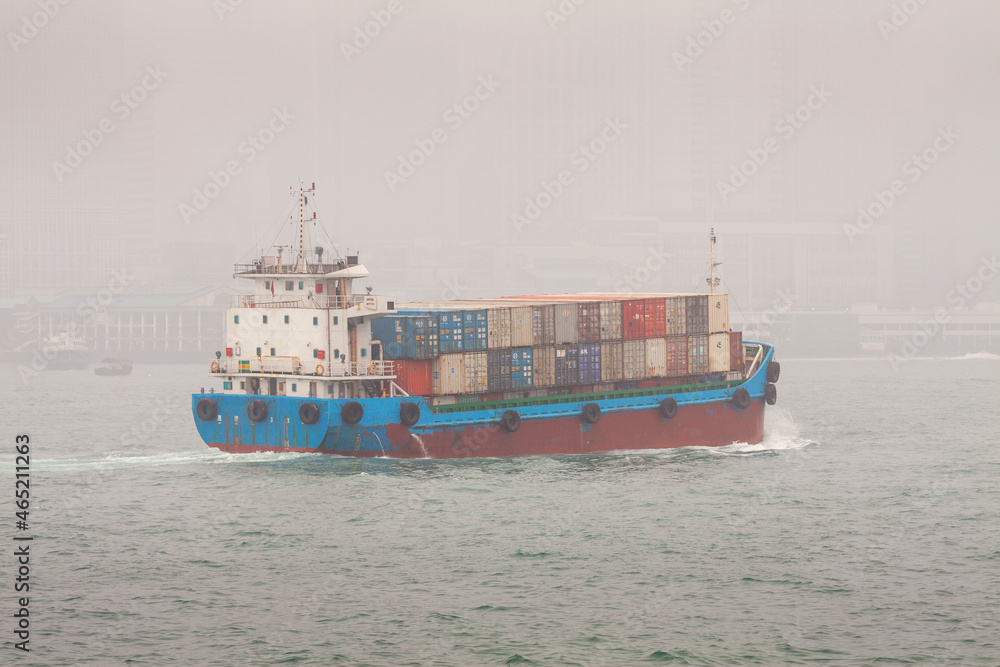 Container Ship on Victoria Harbour in Fog