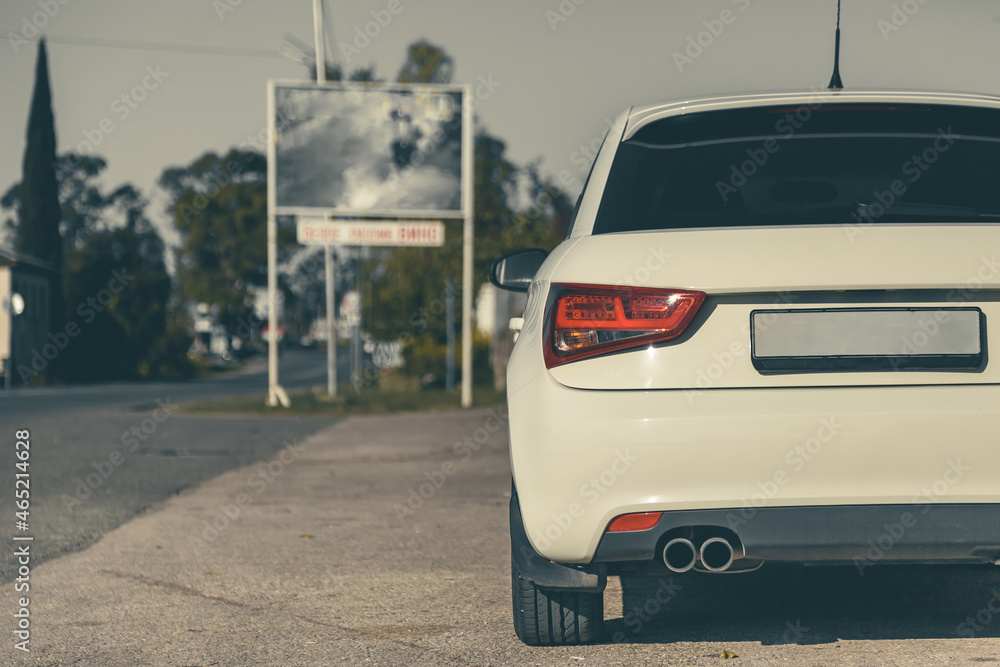 the back of a modern car, red taillights