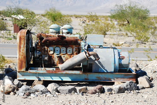 Shot of a gas station decorative rusty engine in the Death Valley in California, the US photo