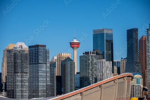 View of the Calgary Tower with modern skyscrapers under the blue sky,  Alberta, Canada photo
