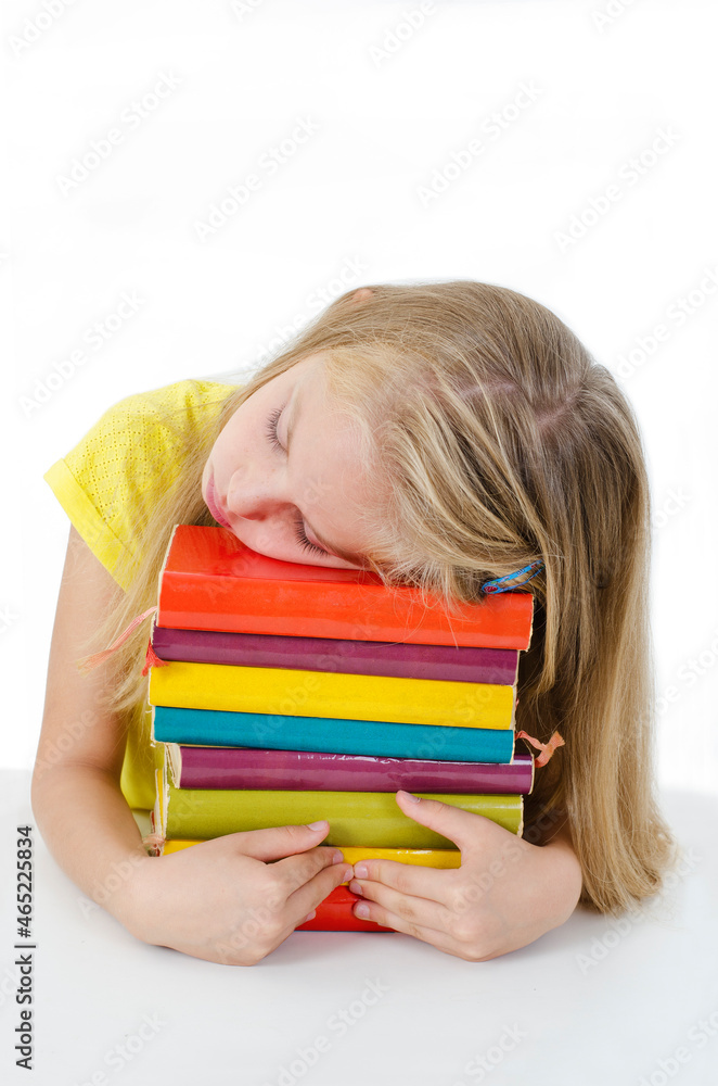 Sleeping while learning - tired little girl sleeping on desk. Isolated on white background
Sleeping while learning - tired little girl sleeping on desk. Isolated on white background
