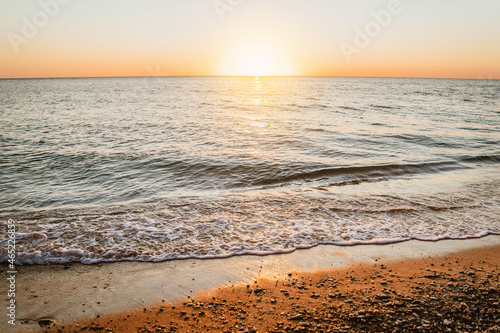 Fototapeta Naklejka Na Ścianę i Meble -  Beautiful sunset on the sea on the beach in summer, amazing summer landscape with waves
