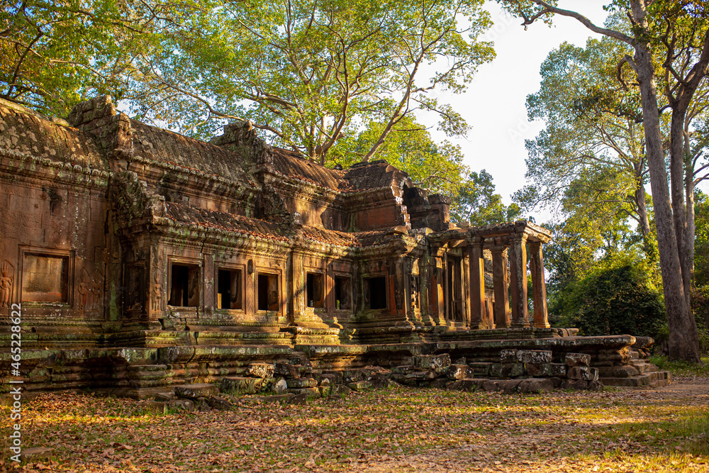 The ancient city of Angkor Wat in Cambodia. Towers of the temple of the Kmer people streets and ruins of houses. Traveling to the sights of ancient civilizations. Stone bas-reliefs on the ruins. The ancient city of Angkor Wat in Cambodia. Towers of the temple of the Kmer people streets and ruins of houses. Traveling to the sights of ancient civilizations. Stone bas-reliefs on the ruins.