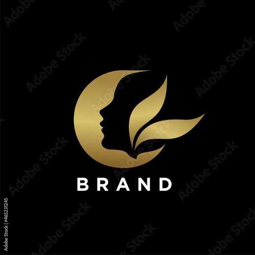 Abstract logo of woman's head in gold color for spa or beauty business