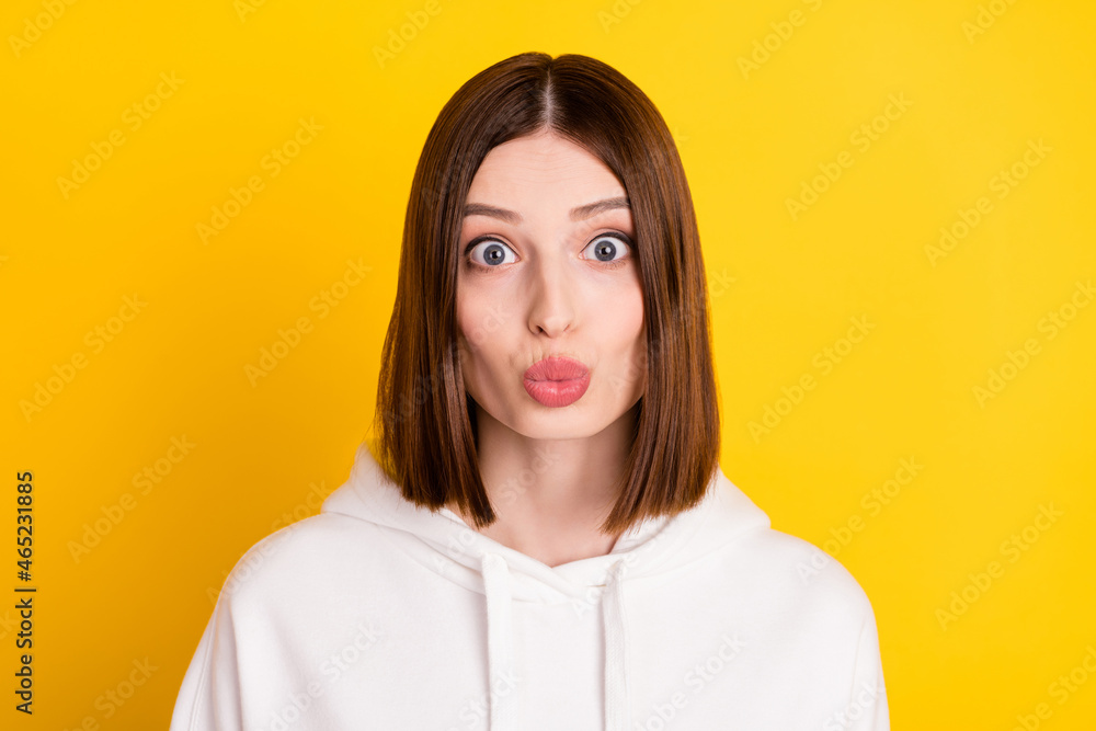 Photo of romantic charming girlfriend lips send air kiss wear white sweatshirt isolated yellow color background Photo of romantic charming girlfriend lips send air kiss wear white sweatshirt isolated yellow color background