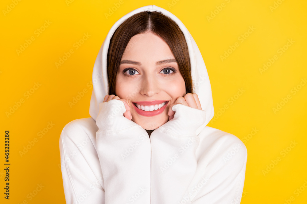 Portrait of attractive cheerful girl enjoying coziness good mood isolated over bright yellow color background Portrait of attractive cheerful girl enjoying coziness good mood isolated over bright yellow color background