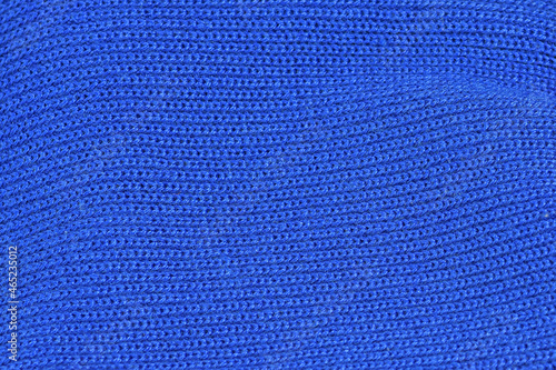 A fragment of knitted woolen fabric in close-up