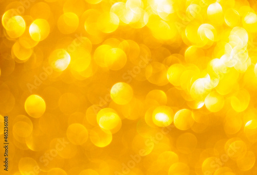 Festive abstract golden lihgts bokeh shiny background