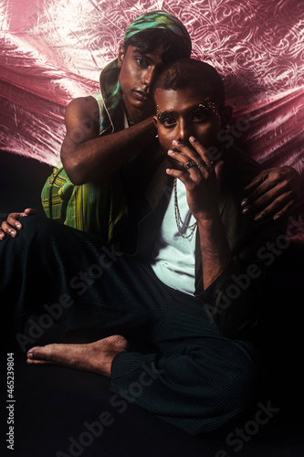 Photography Two Malaysian Indian men in a studio setting with cloth flying in the background