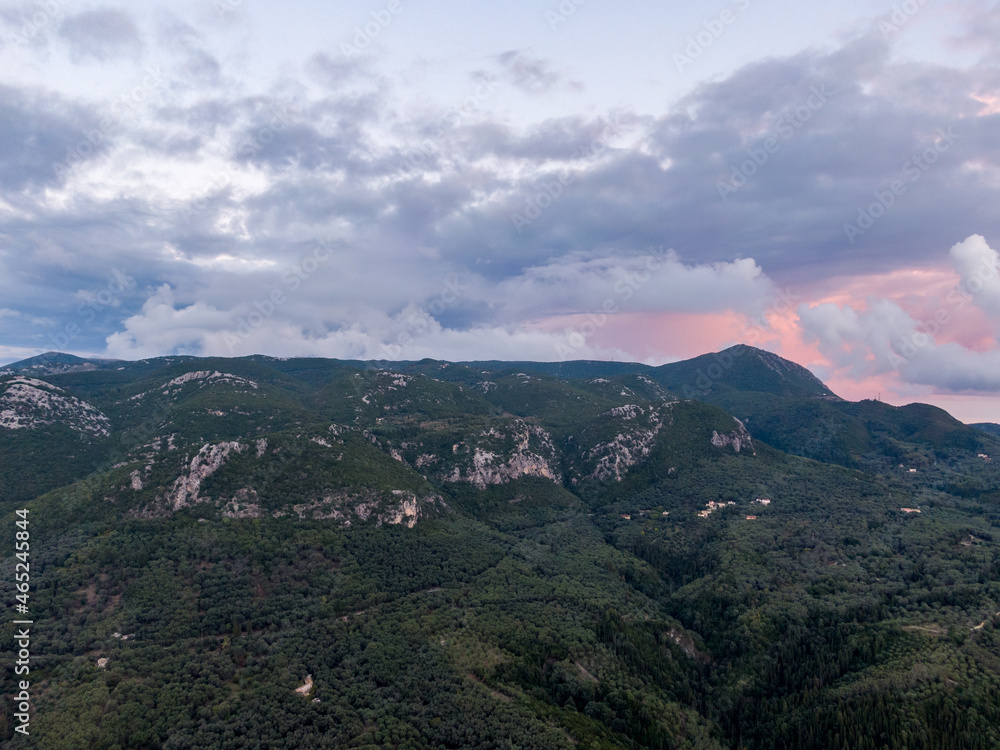 drone shot wirh clouds over the mountain in corfu island greece