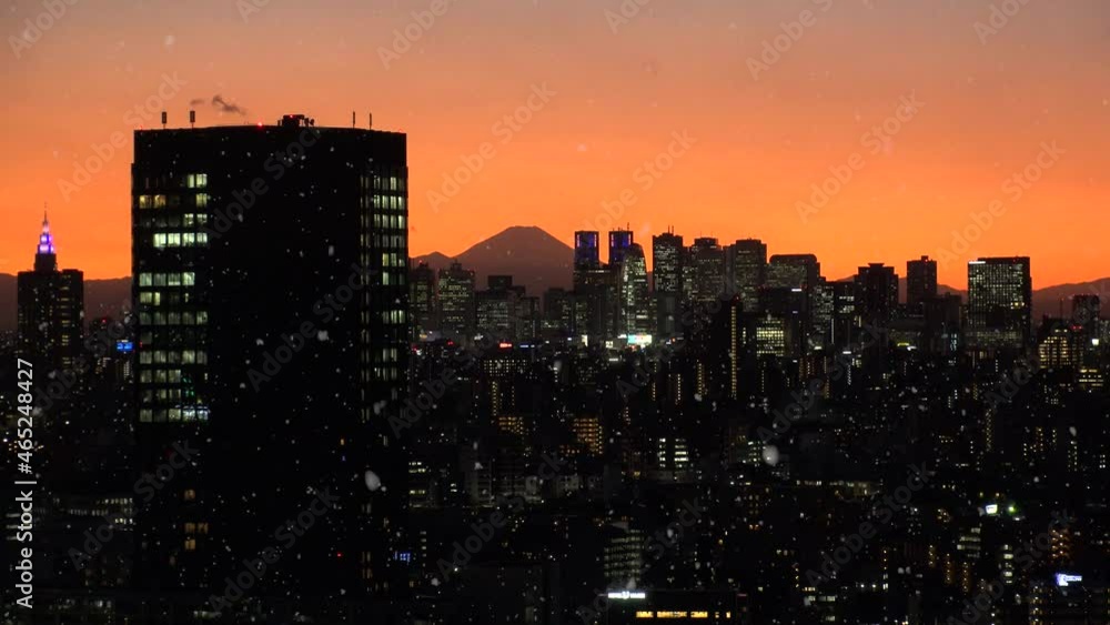 TOKYO, JAPAN : Aerial high angle view of cityscape of Tokyo, Mount Fuji and falling snow. Japanese winter and romantic Christmas season concept. Real time shot in sunset or sunrise. TOKYO, JAPAN : Aerial high angle view of cityscape of Tokyo, Mount Fuji and falling snow. Japanese winter and romantic Christmas season concept. Real time shot in sunset or sunrise.