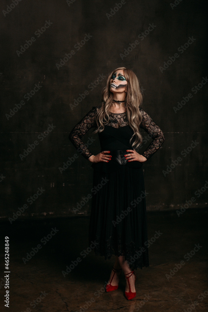 The image of a skeleton girl for Halloween. Female image for Halloween. The image of a skeleton girl for Halloween. Female image for Halloween. the woman has long blonde wavy hair, a lace black dress The image of a skeleton girl for Halloween. Female image for Halloween. The image of a skeleton girl for Halloween. Female image for Halloween. the woman has long blonde wavy hair, a lace black dress