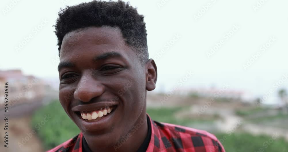 Young african man smiling on camera Young african man smiling on camera