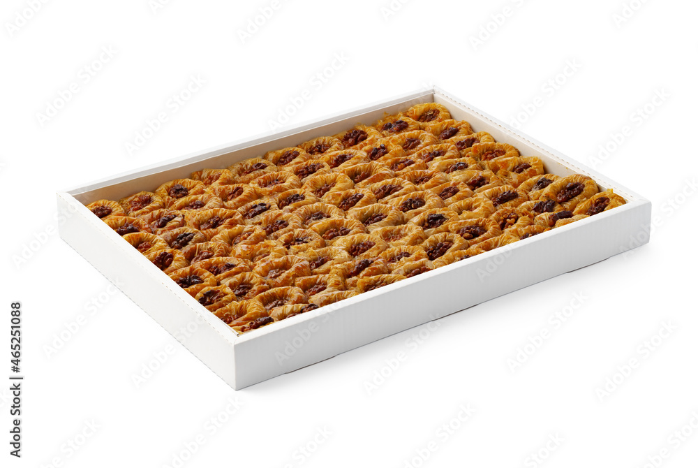 Turkish baklava dessert in a white box isolated on white. Turkish baklava dessert in a white box isolated on white.