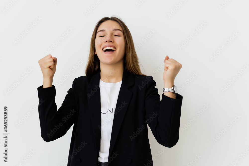 Excited business woman celebrating a triumph over a white background Excited business woman celebrating a triumph over a white background