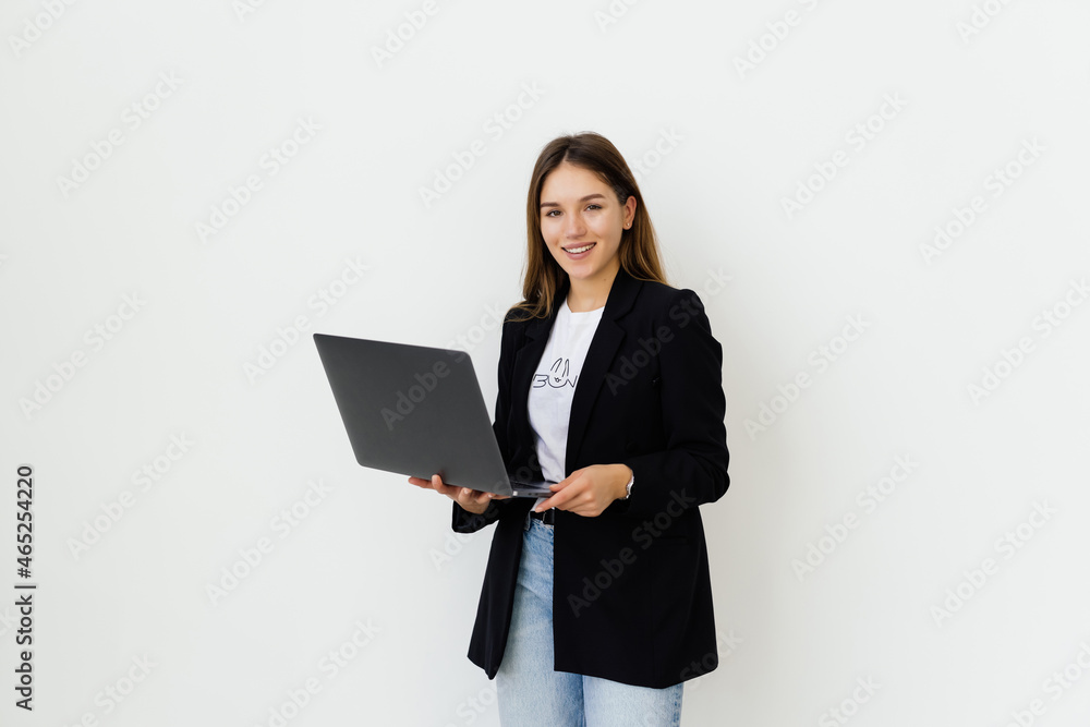 Portrait of a businesswoman working on laptop computer isolated over white background Portrait of a businesswoman working on laptop computer isolated over white background