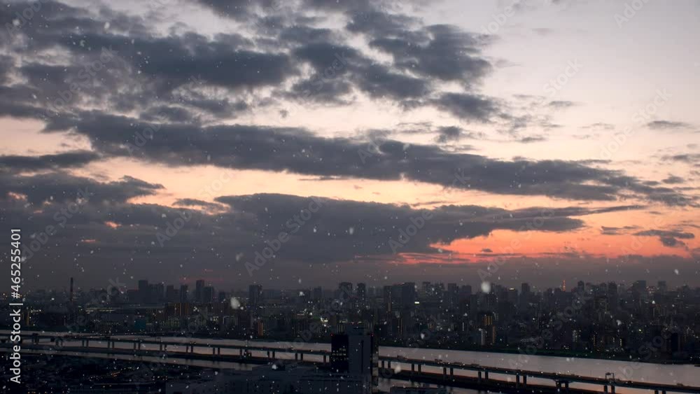 TOKYO, JAPAN : Aerial high angle view of cityscape of Tokyo and falling snow. Japanese winter and romantic Christmas season concept. Real time shot in sunset or sunrise. TOKYO, JAPAN : Aerial high angle view of cityscape of Tokyo and falling snow. Japanese winter and romantic Christmas season concept. Real time shot in sunset or sunrise.