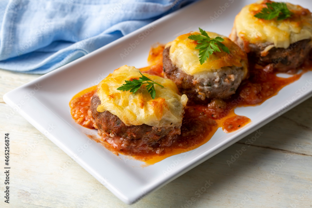 Turkish Food Hasanpasa Kofte - Kofta with Puree - Meatball with Bechamel Sauce and Green Peas. Traditional Food.