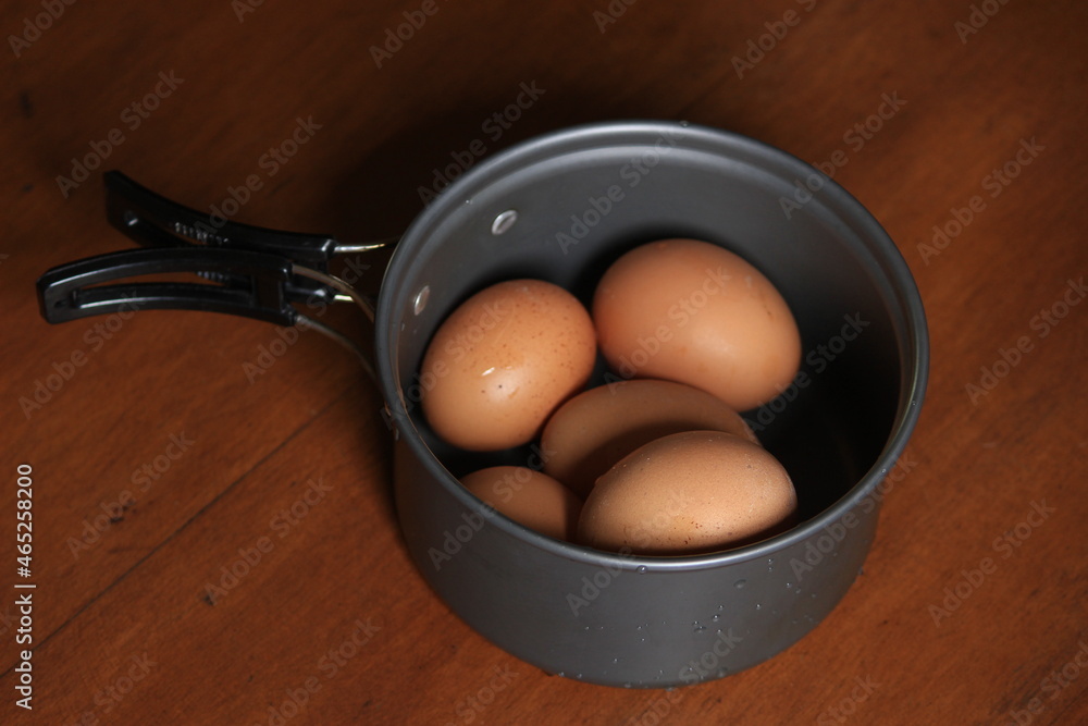 Fresh chicken eggs with artistic shell pattern, ready to cook.
Fresh chicken eggs with artistic shell pattern, ready to cook.