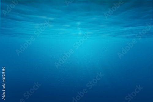 Blue sea or ocean underwater with synbeam and ripples. © Sondem