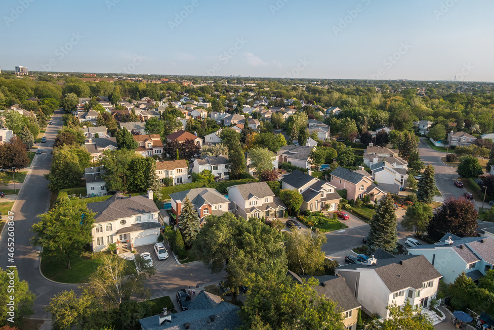 Aerial view of houses and streets in beautiful residential neighbourhood in Montreal, Quebec, Canada. Property, housing and real estate concept, summer season.