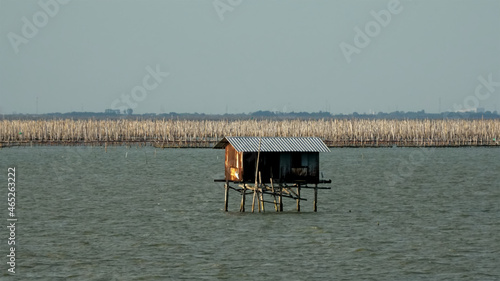 Landscape view with small old wooden house on ocean fisherman. Bangsaen Thailand