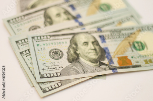 Stacks of paper 100 dollars USA on the white background © scullery